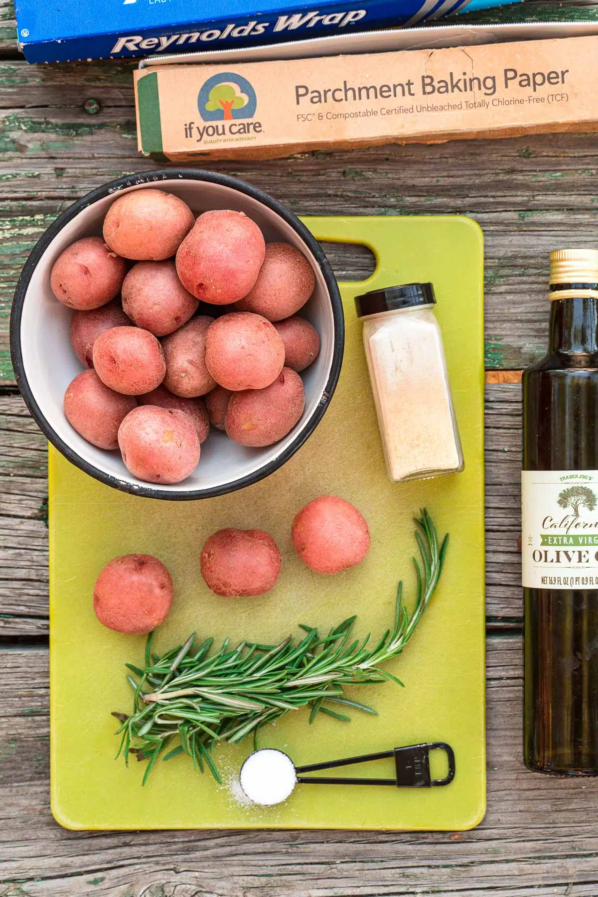 Ingredients for grilled potatoes on a cutting board