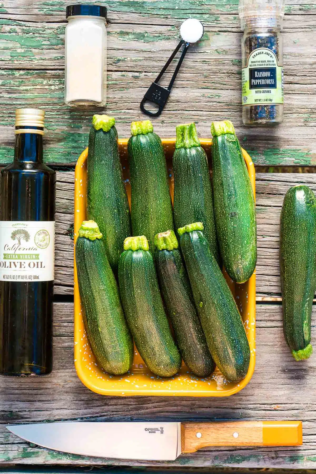 Whole zucchinis in a yellow dish