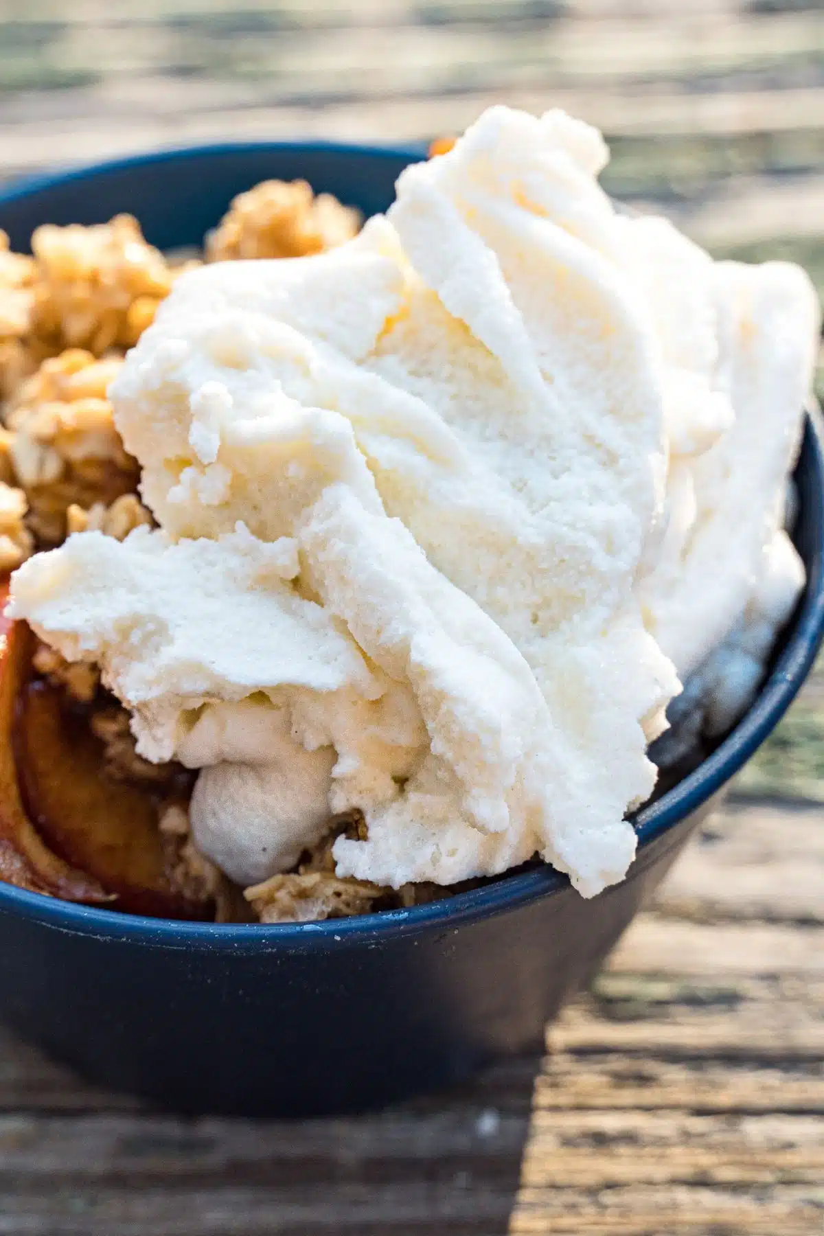 Ice cream scooped into a small blue dish.