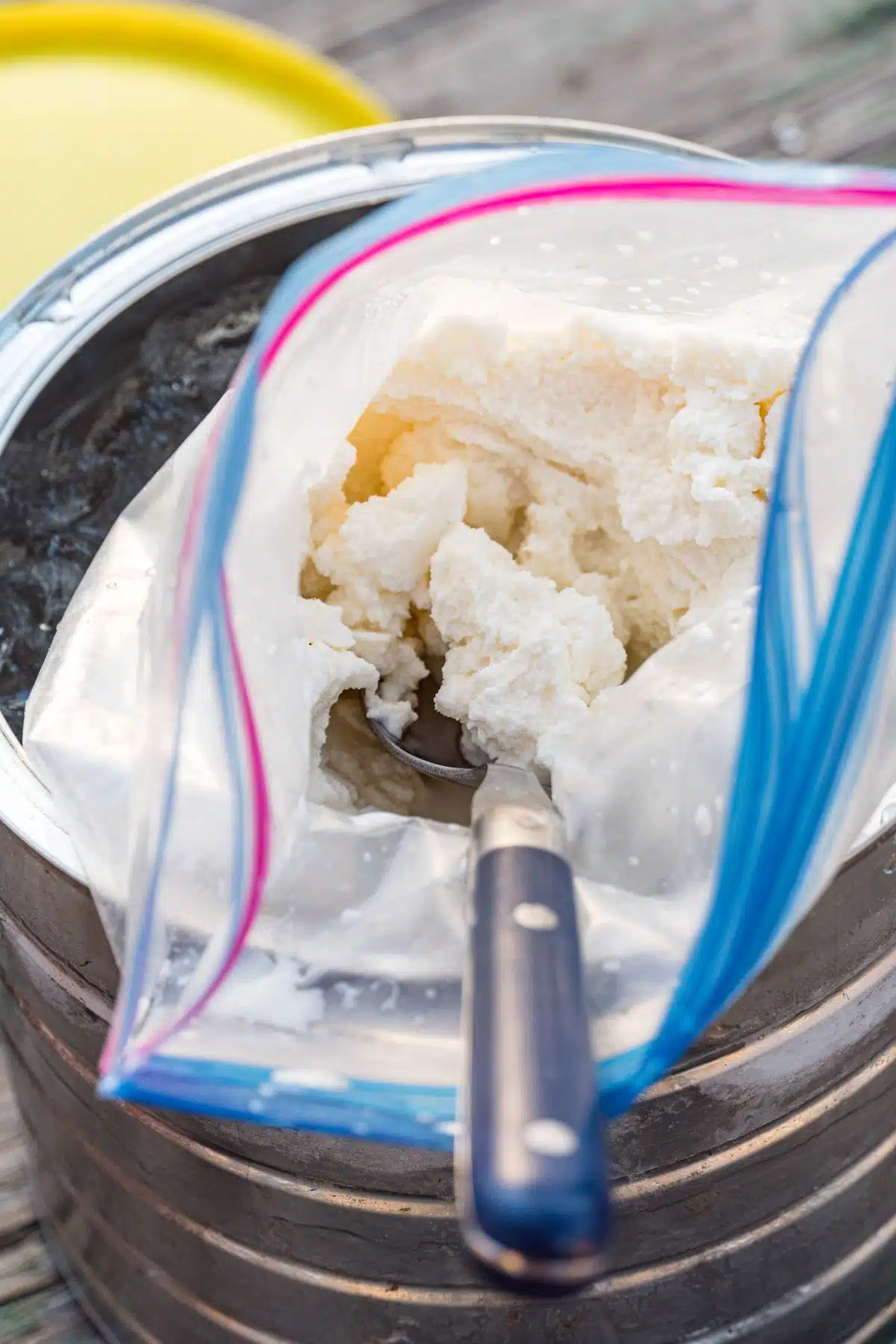 Ice cream in a plastic bag with a spoon.