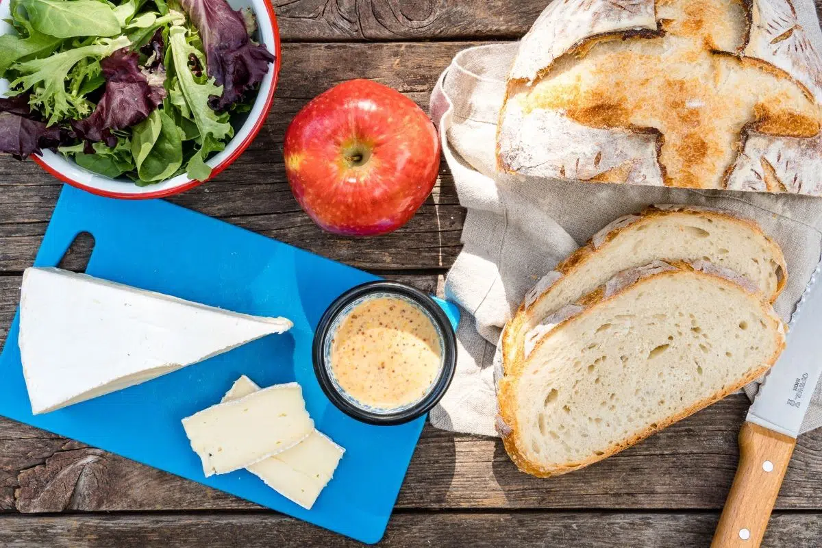 Ingredients for brie grilled cheese on a camping table