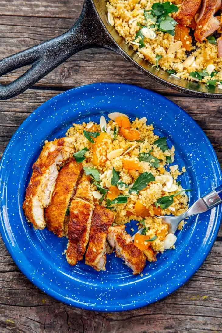 Moroccan spiced chicken on a blue camping plate