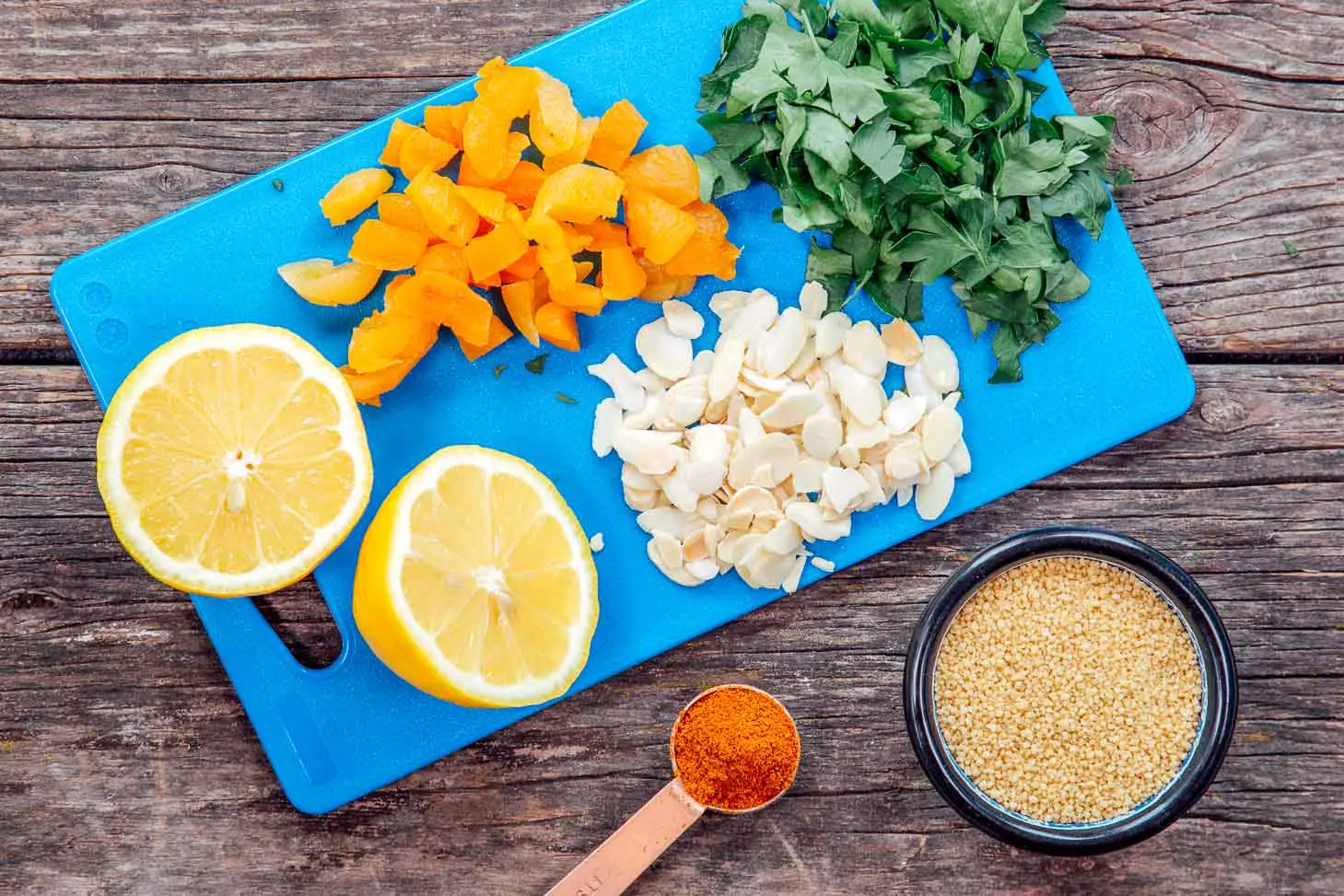 Ingredients for Moroccan spiced couscous on a cutting board