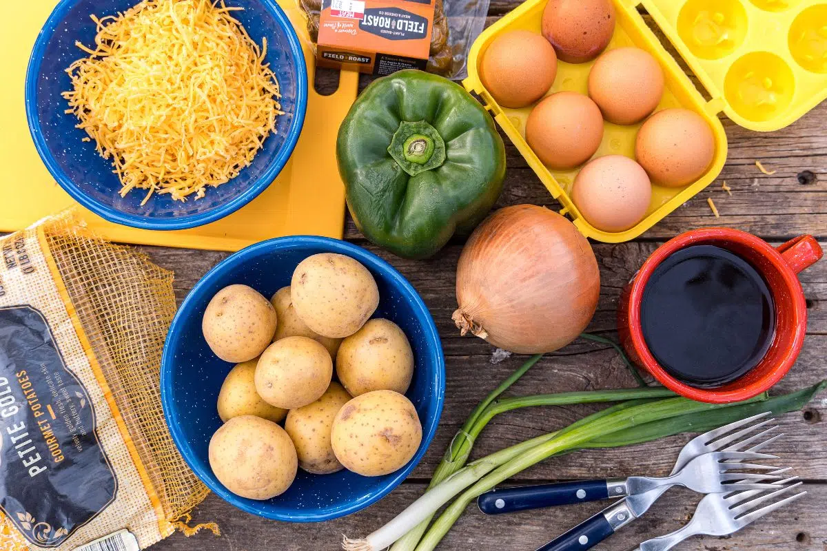 Ingredients for a breakfast skillet laid out on a table