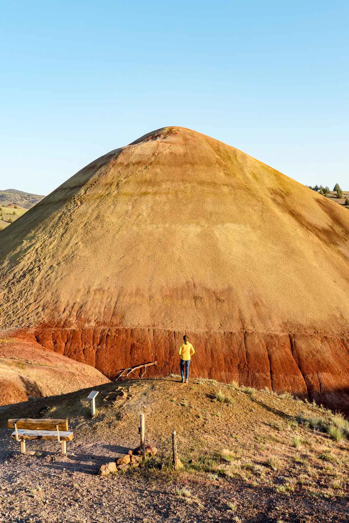 Megan standing at an overlook in front of the Red Hill