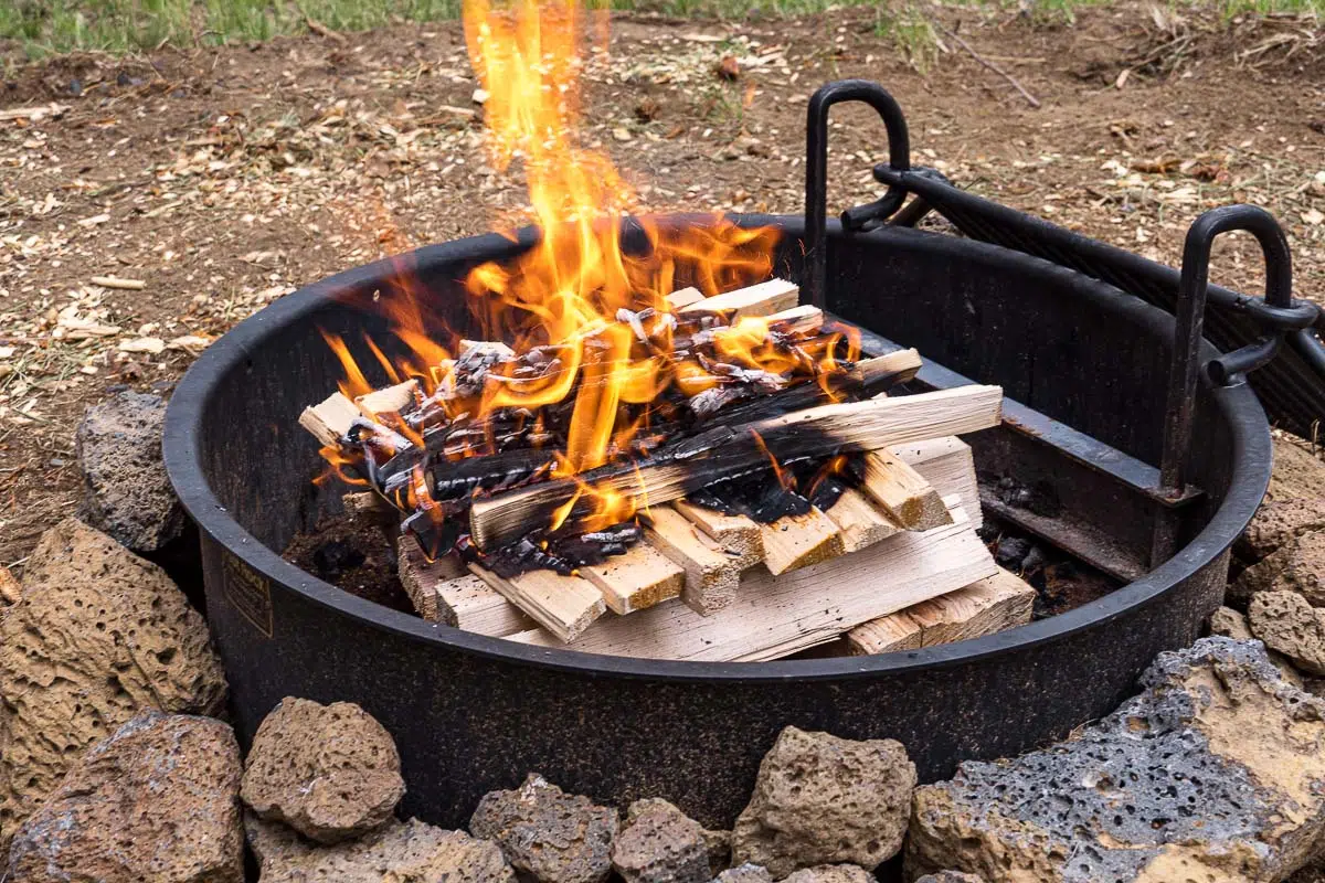 Wood logs arranged in a platform campfire formation