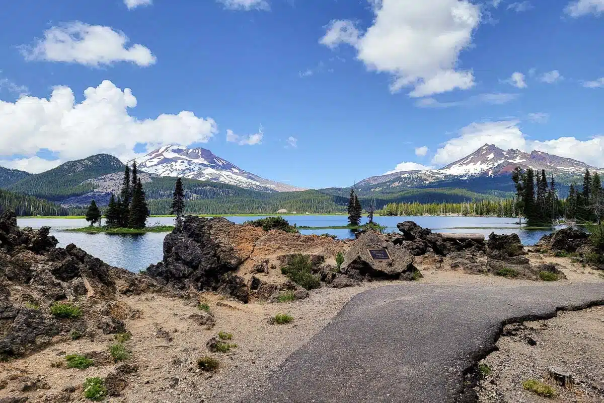 A paved path with Sparks Lake in view