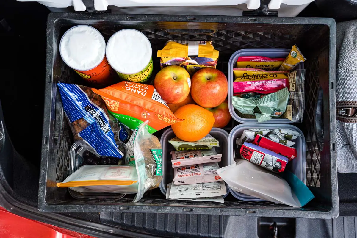 A box full of road trip snacks