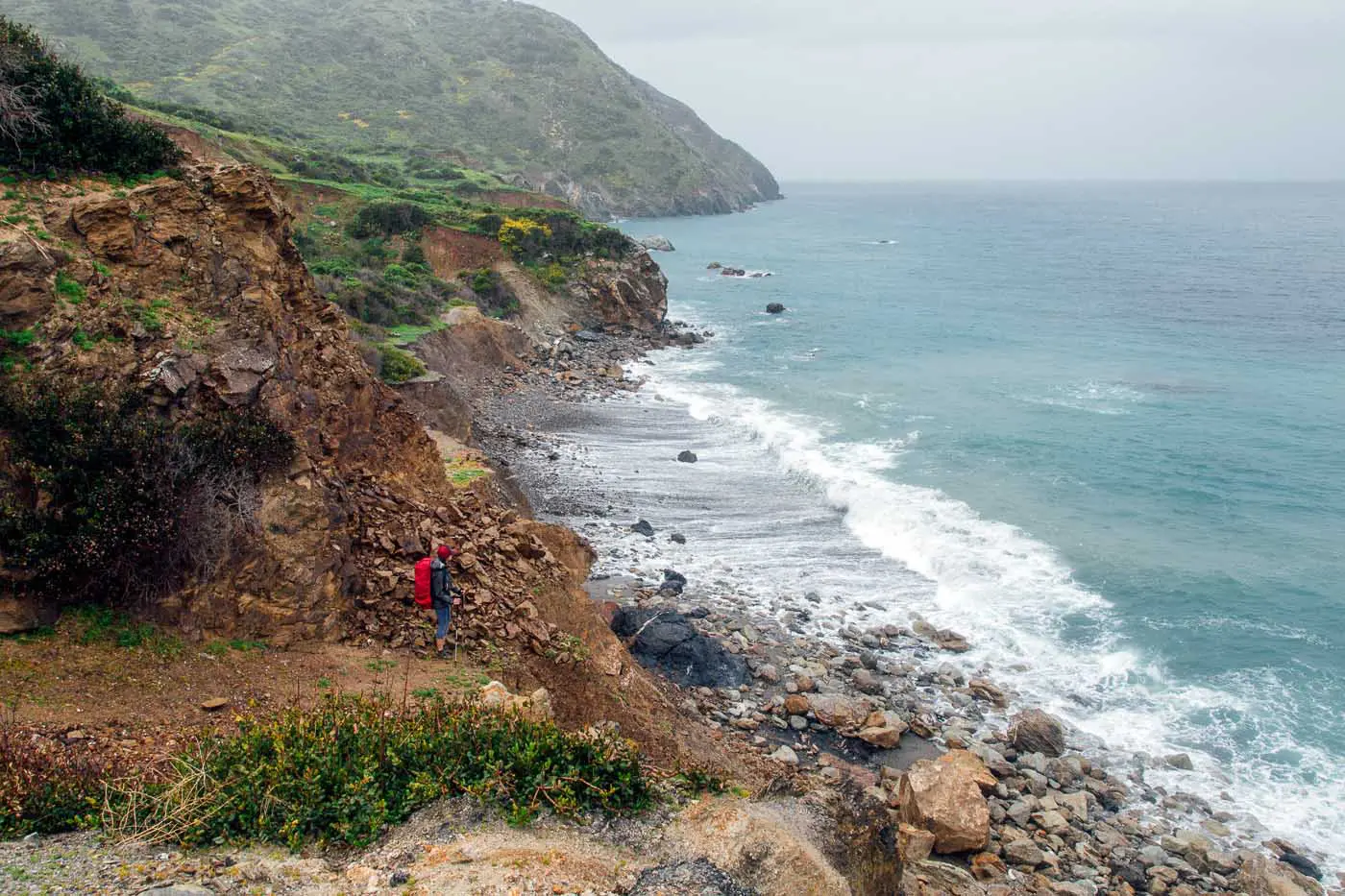 Woman standing at the edge of the rugged coastline of Catalina Island's Starlight Beach