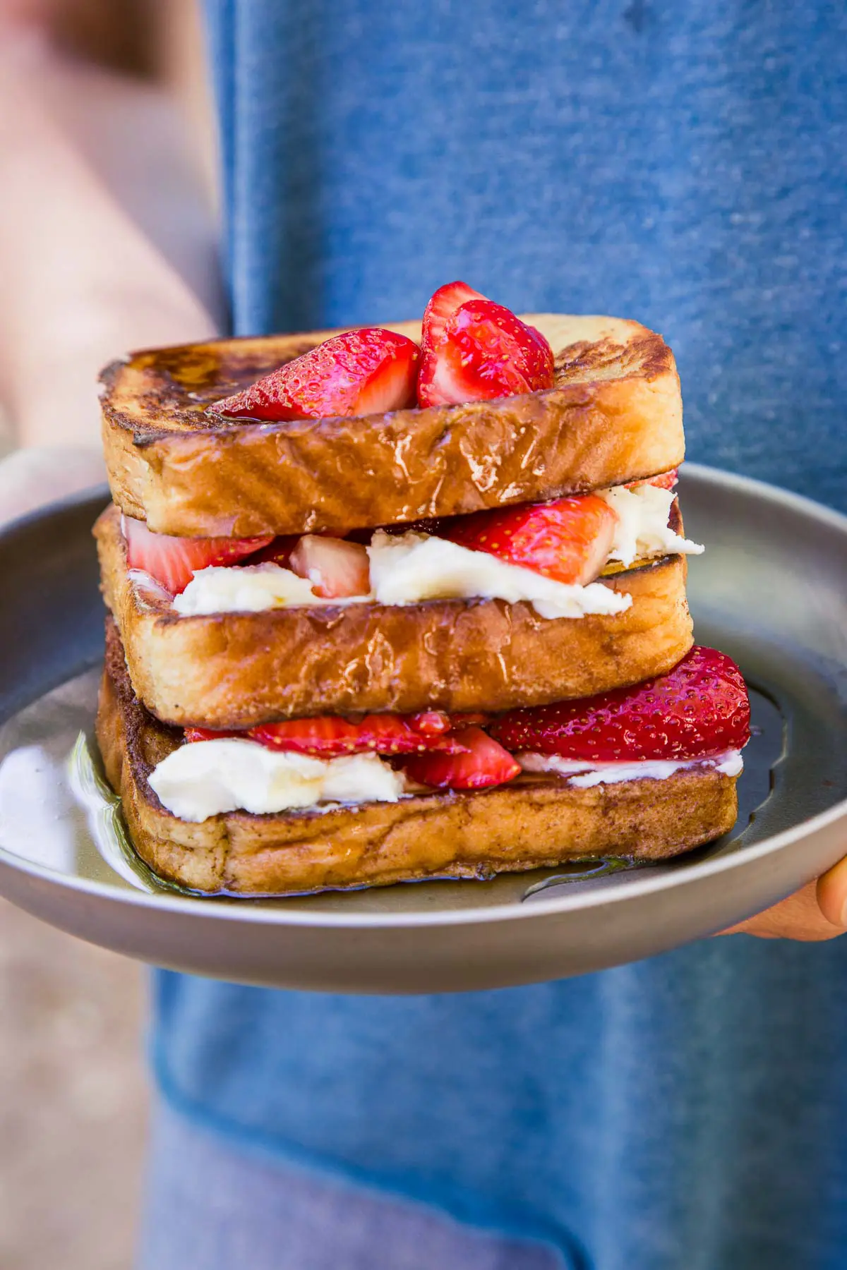 Michael holding a plate of stuffed french toast