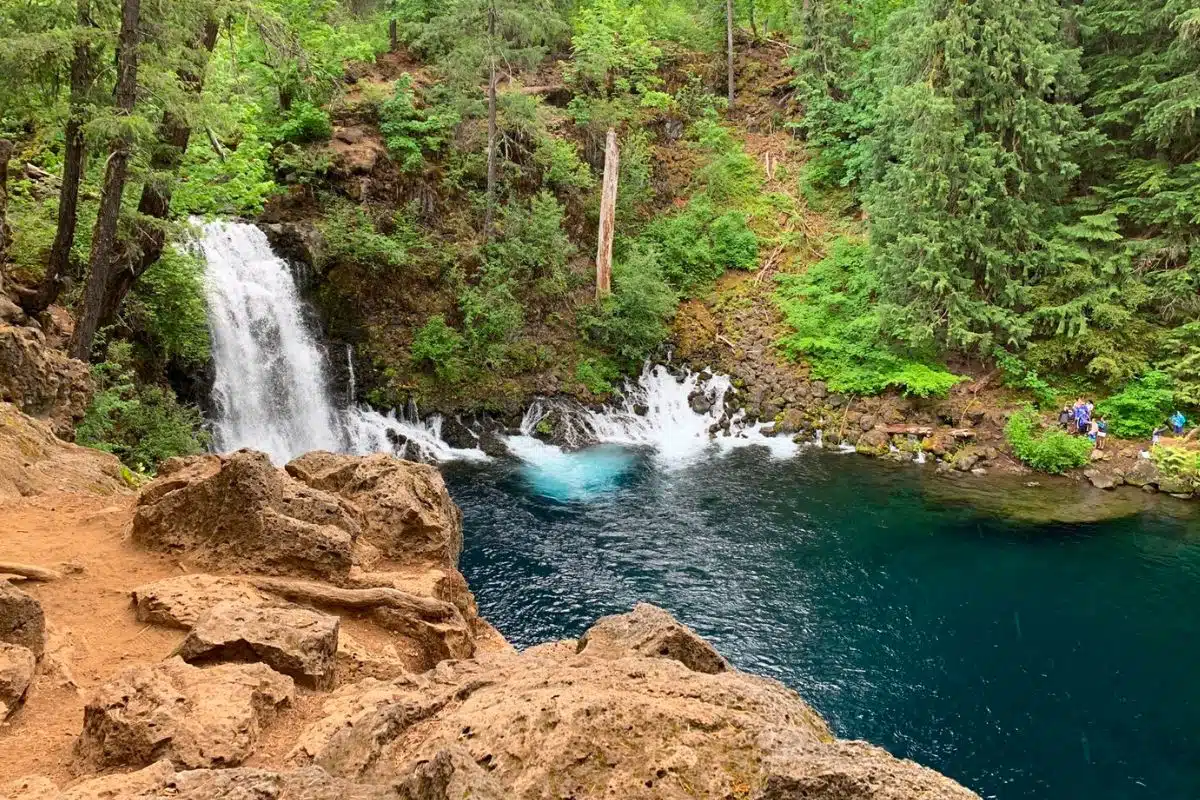 Tamolitch waterfall cascading into the blue pool below