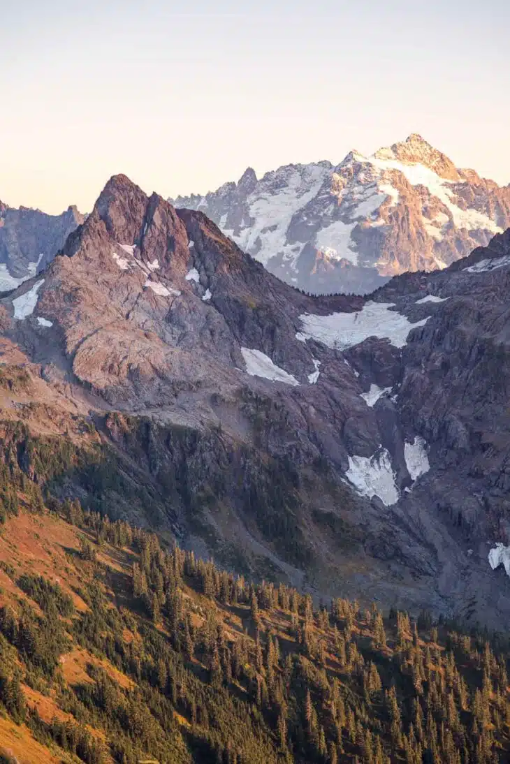 Mountain peaks with snow patches.