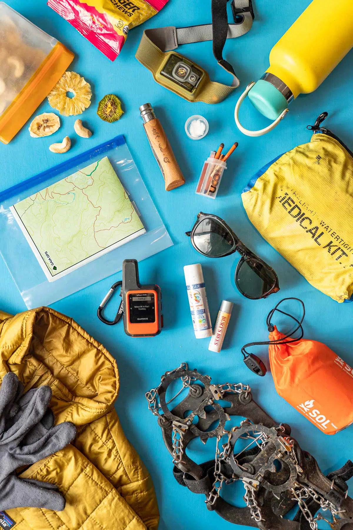 Flatlay of winter hiking 10 essentials